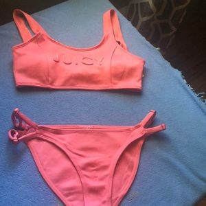 This is a coral colored juicy couture bathing suit